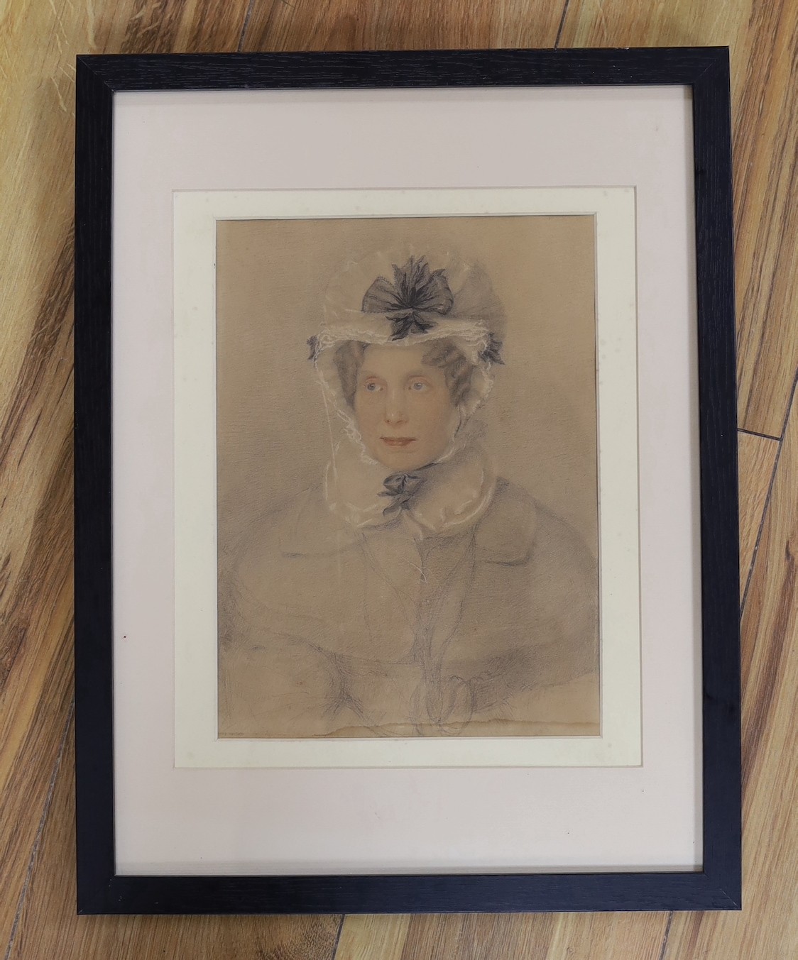 Attributed to George Richmond RA (1809-1896), pencil and watercolour on paper, portrait of a lady in a bonnet, 26 x 19cm